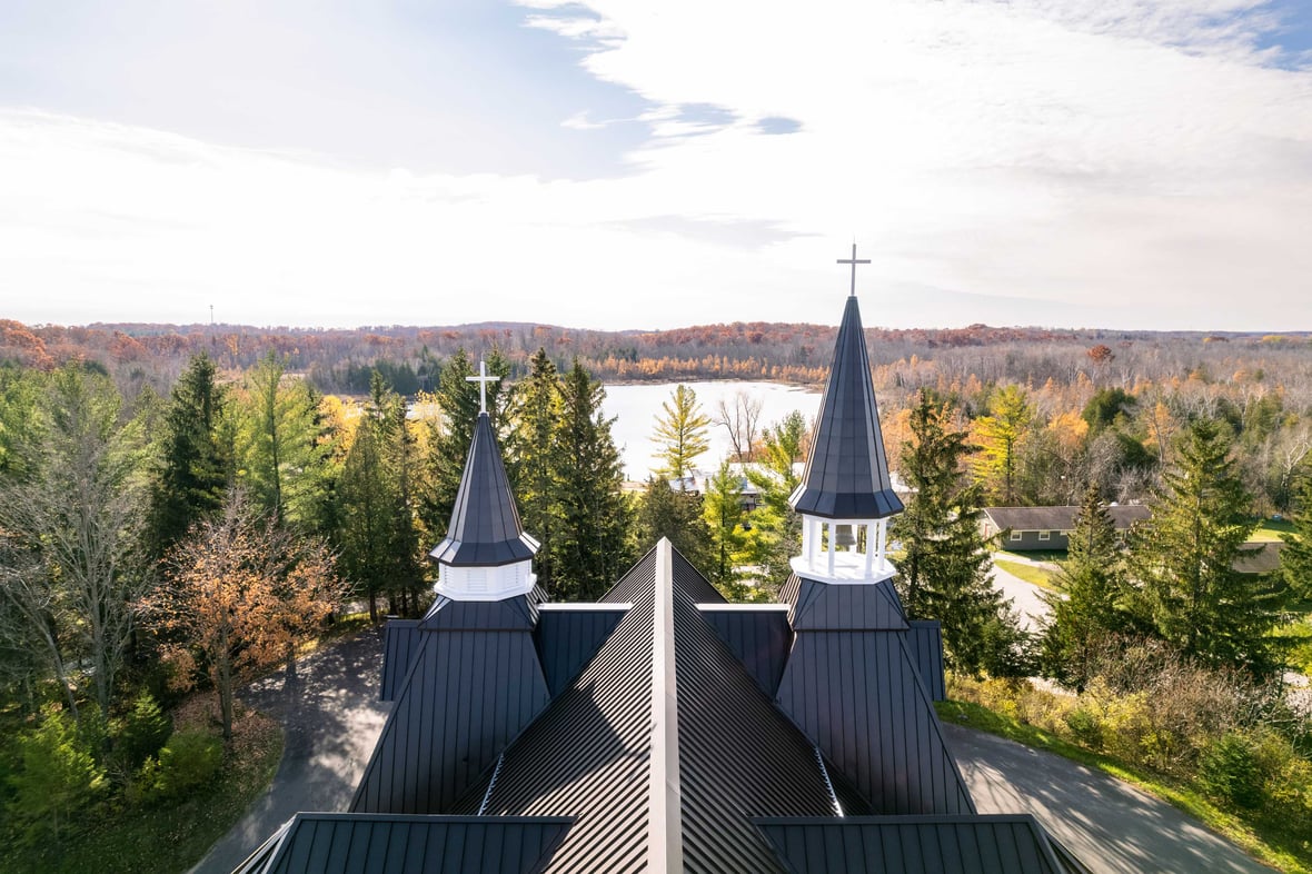 aerial view C.D. Smith Construction Manager for Camp Vista chapel project with wood beams, stone wall masonry and patio