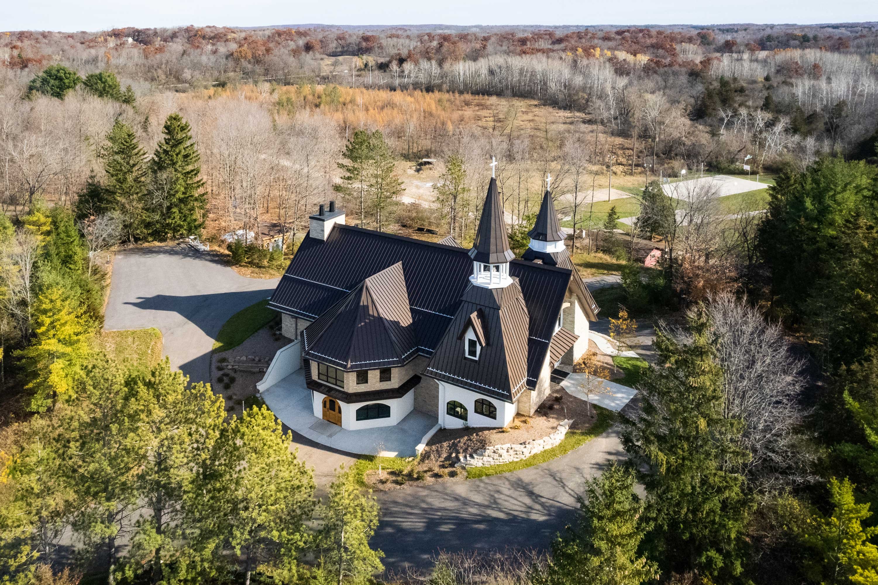 aerial view C.D. Smith Construction Manager for Camp Vista chapel project with wood beams, stone wall masonry and patio