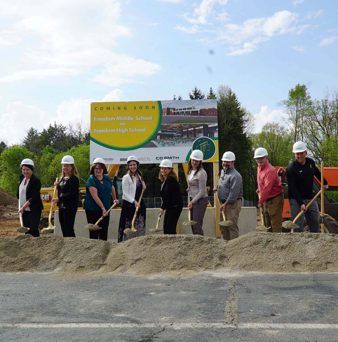 Freedom Area School District leaders, students and community members participate in the ceremonial groundbreaking with shovels at the construction site.