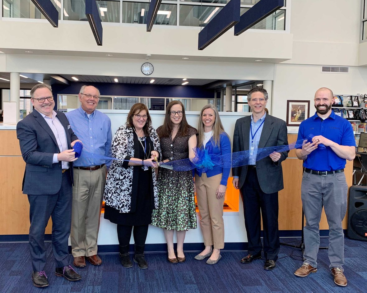 Ribbon-cutting participants in Kohler Public Library at dedication ceremony in Wisconsin