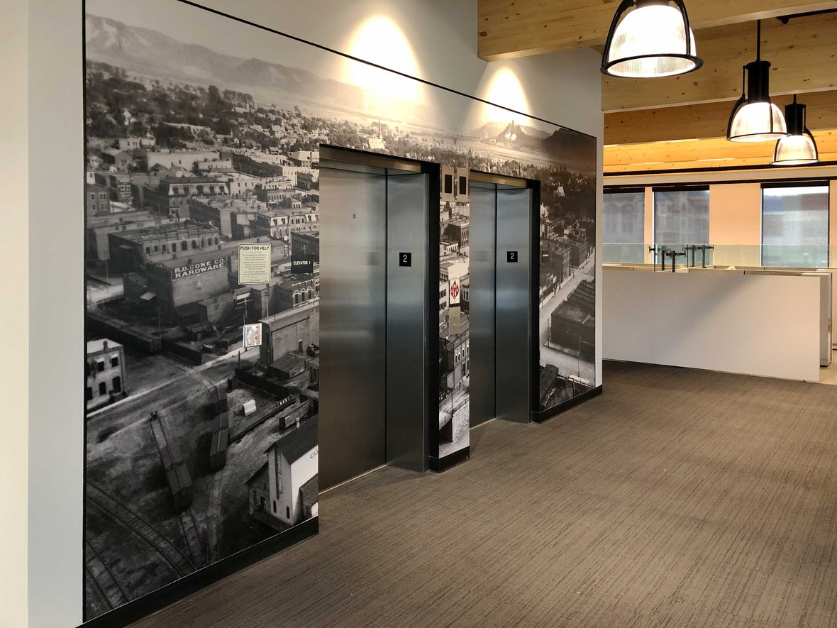 Fastenal Company new corporate office mass timber building interior view of elevators and wall graphic