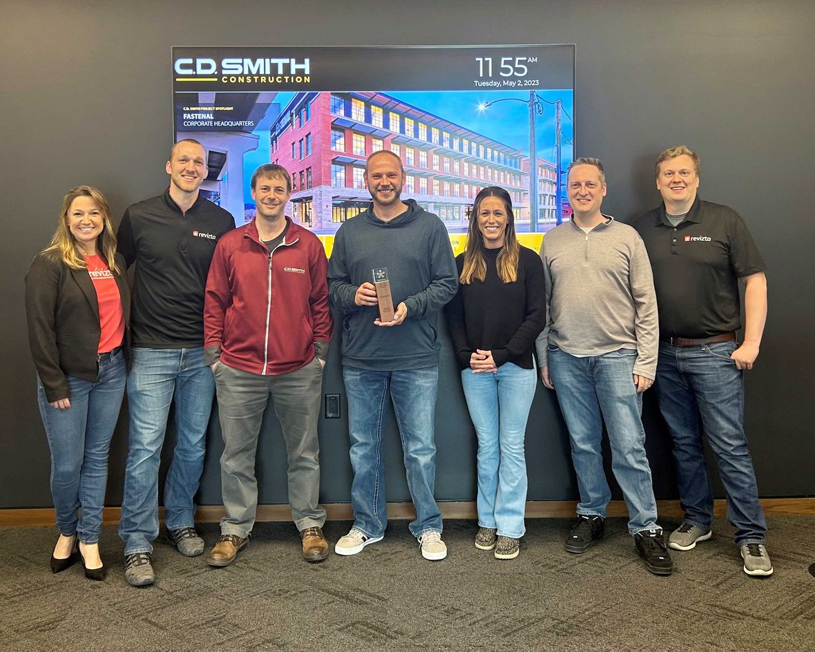 C.D. Smith Construction Virtual Design and Construction Team pose for picture with award at Fond du Lac Corporate Office in Wisconsin