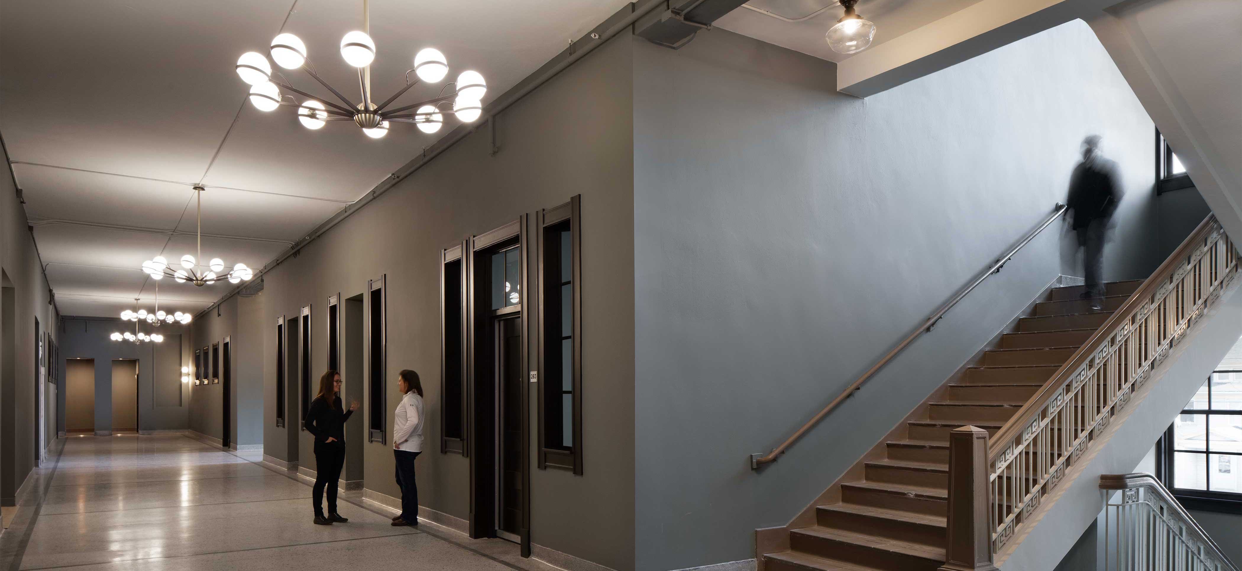 Whitney School Lofts historic construction rehabilitation project hallway corridor and stairs