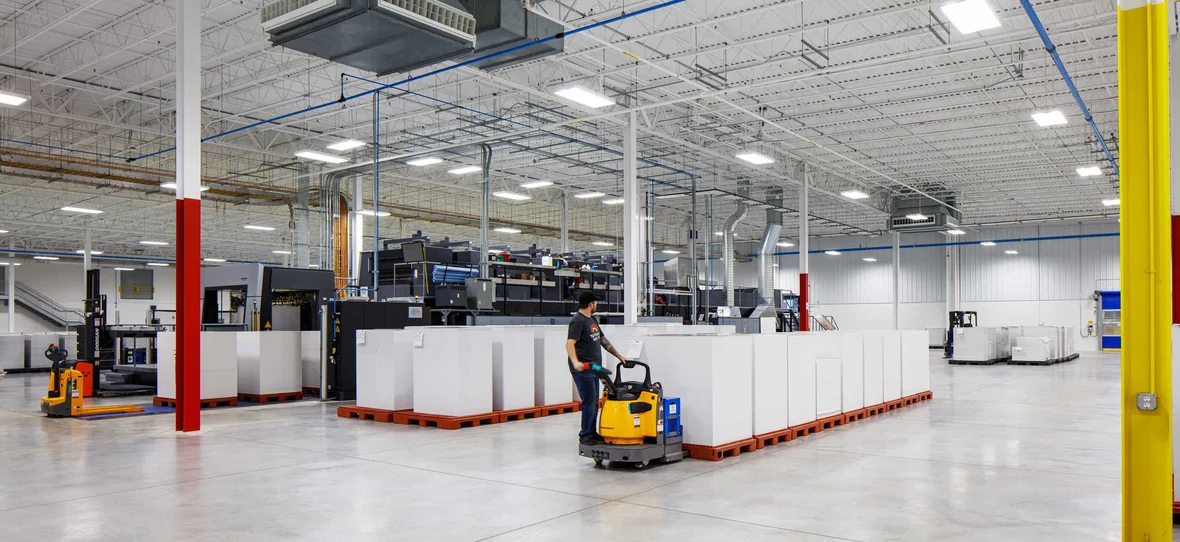 Green Bay Packaging Folding Carton Facility Industrial Interior and worker pallet jack in De Pere Wisconsin built by CD Smith Construction