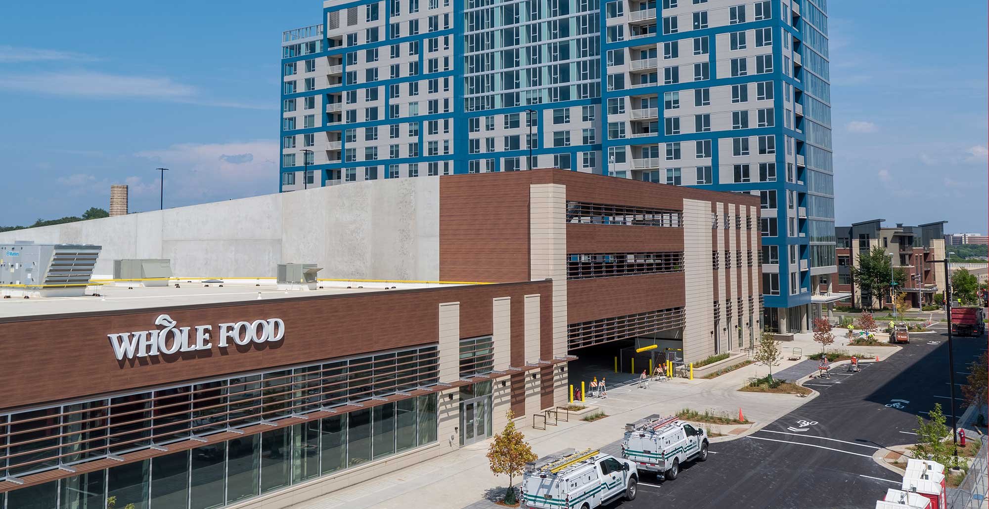 Whole Foods Market storefront and adjacent parking structure at Madison Yards mixed use development in Madison, Wisconsin.