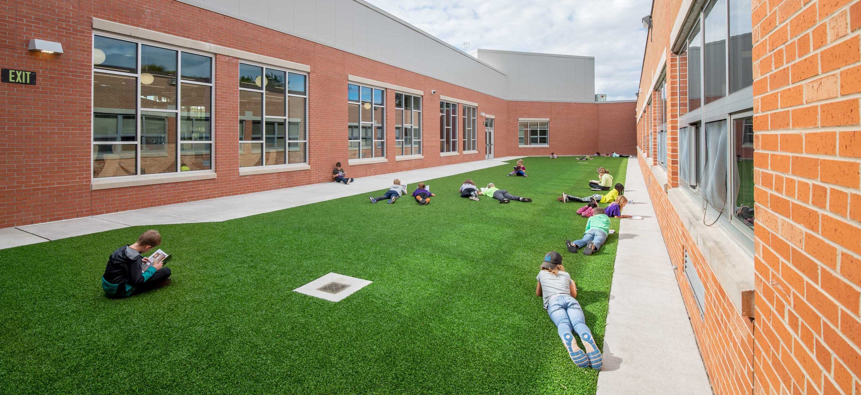 Modern School Building C.D. Smith Construction Manager & Preconstruction Marinette Intermediate School Addition Renovation Project turf courtyard