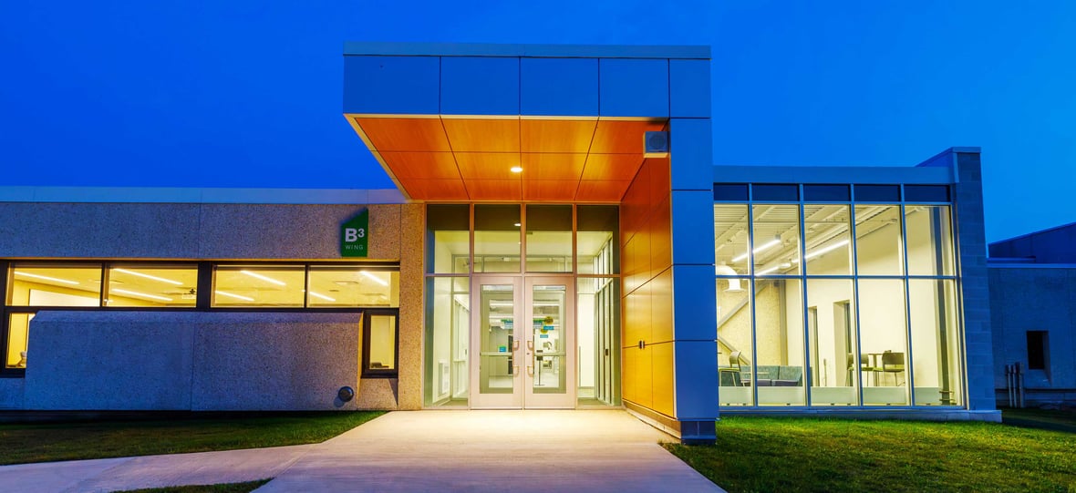 Nighttime view of the newly constructed Moraine Park Technical College AIR Center's exterior facade in Fond du Lac, Wisconsin.