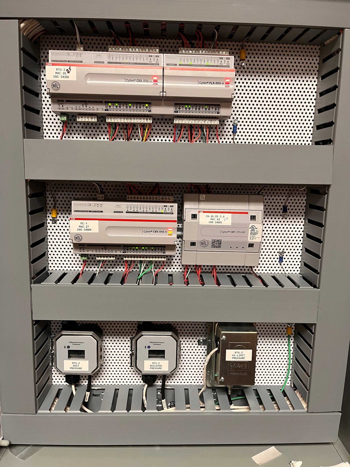 One-Trade Prefabrication in commercial construction: HVAC control panels assembled off-site for a Wisconsin project, then installed and connected on-site by C.D. Smith to ensure quality, efficiency, and reduced construction time.