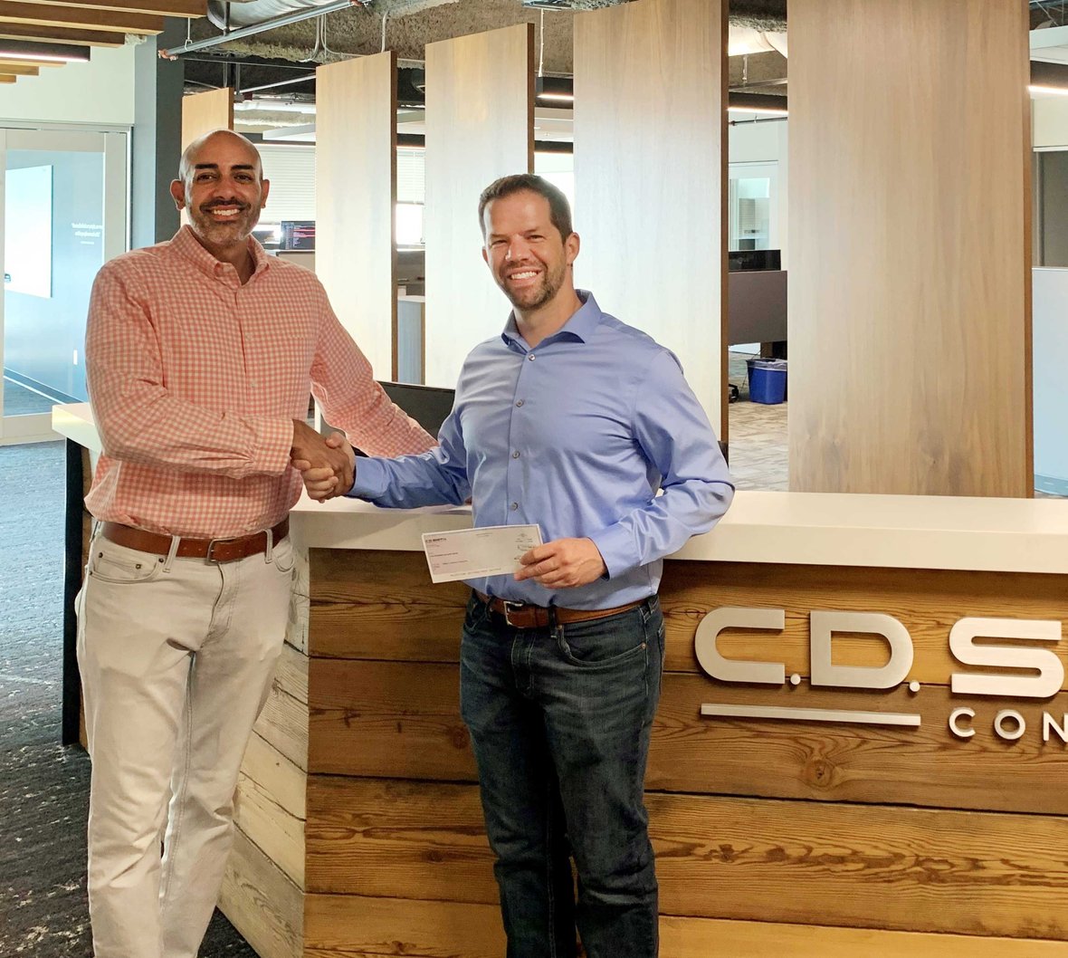 Nanak Malhotra (at left) pictured with SHP WI-Madison Chapter President Casey Klock at C.D. Smith Construction's Madison Office