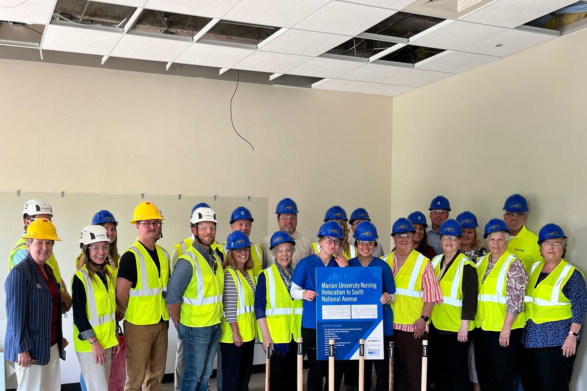 Marian University Executives Faculty Students and Sisters pose for construction demolition bash celebration at new home of the Nursing Program