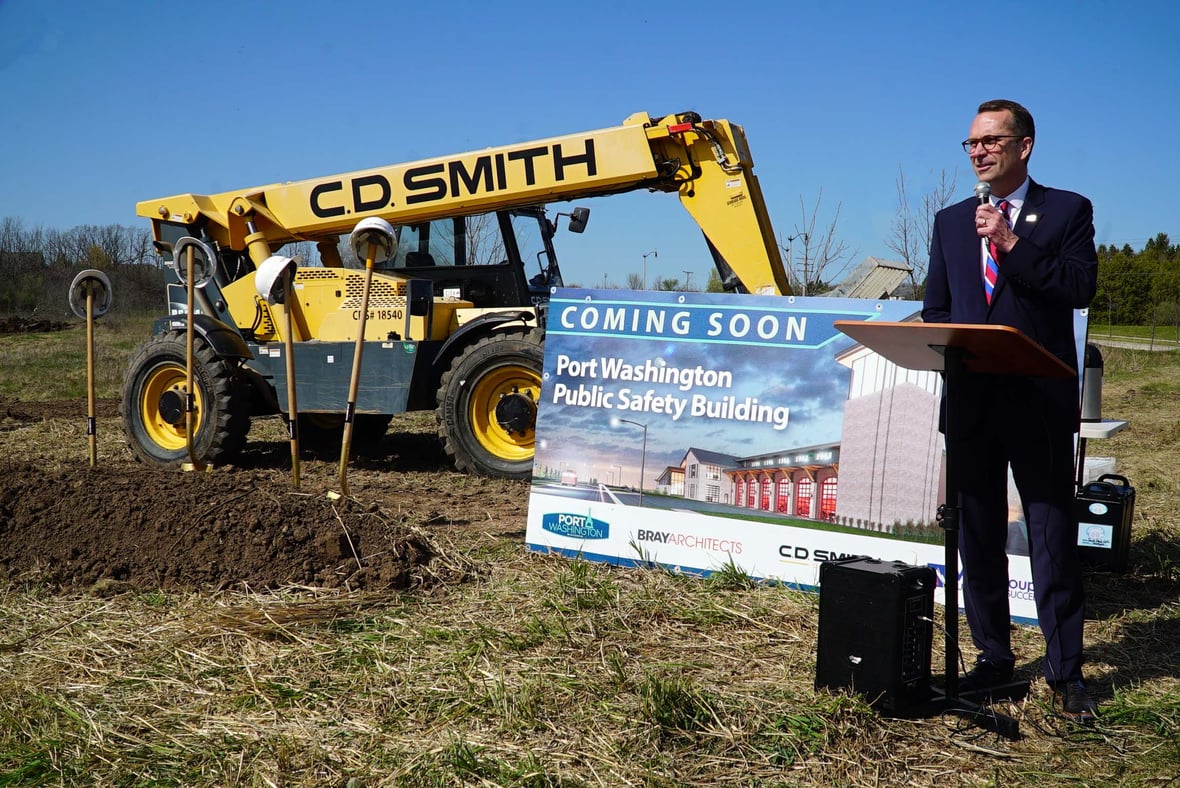Port Washington Mayor Ted Neitzke speaks at groundbreaking ceremony for new Public Safety Building in Wisconsin, a modern municipal construction project.