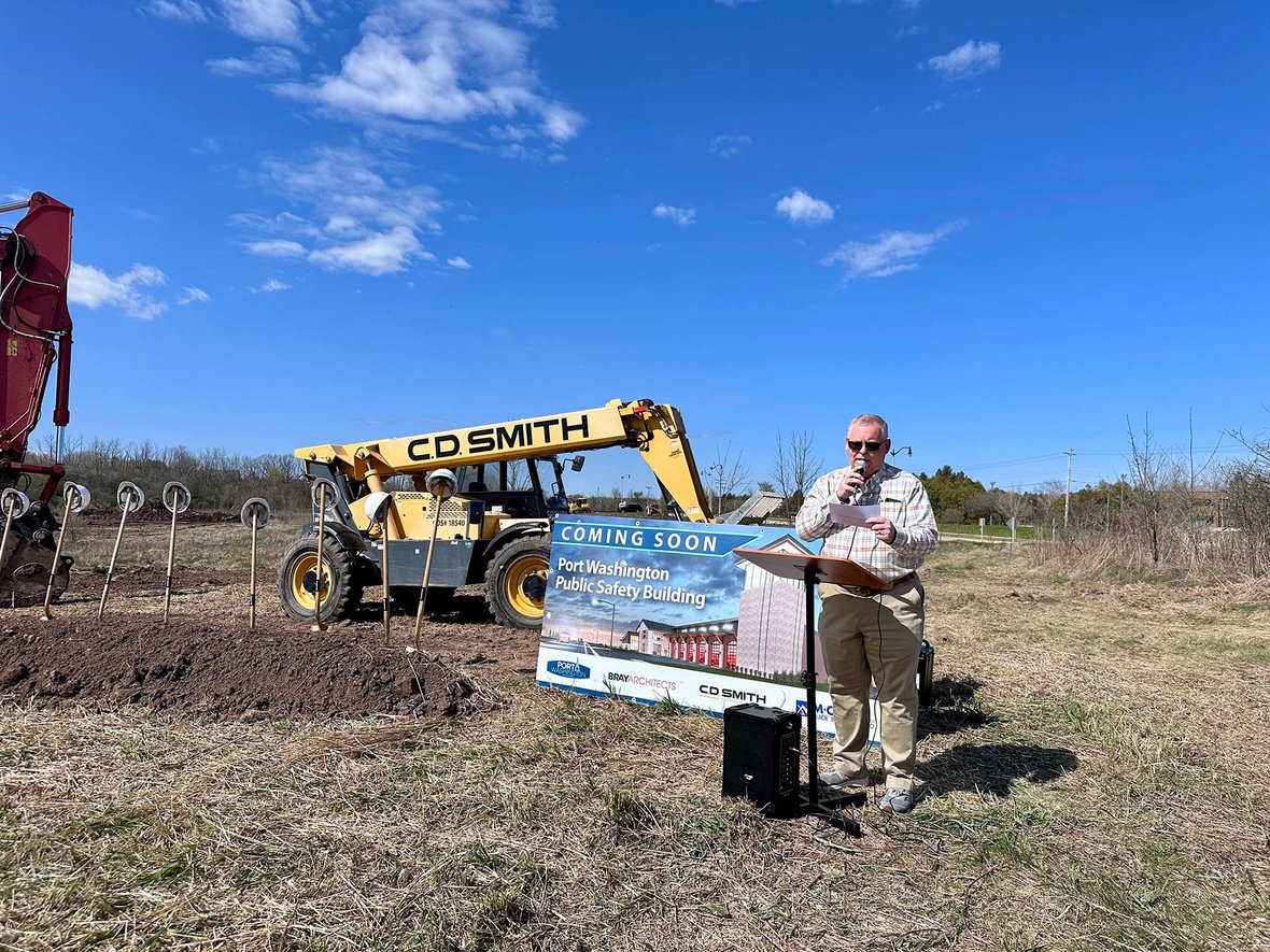 Port Washington Common Council President Dan Benning speaks at groundbreaking ceremony for new Public Safety Building in Wisconsin, a modern municipal construction project.