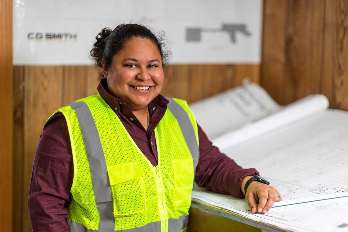 Project Manager Mila Merchan looking over construction drawings in CD Smith Trailer CS0A1349