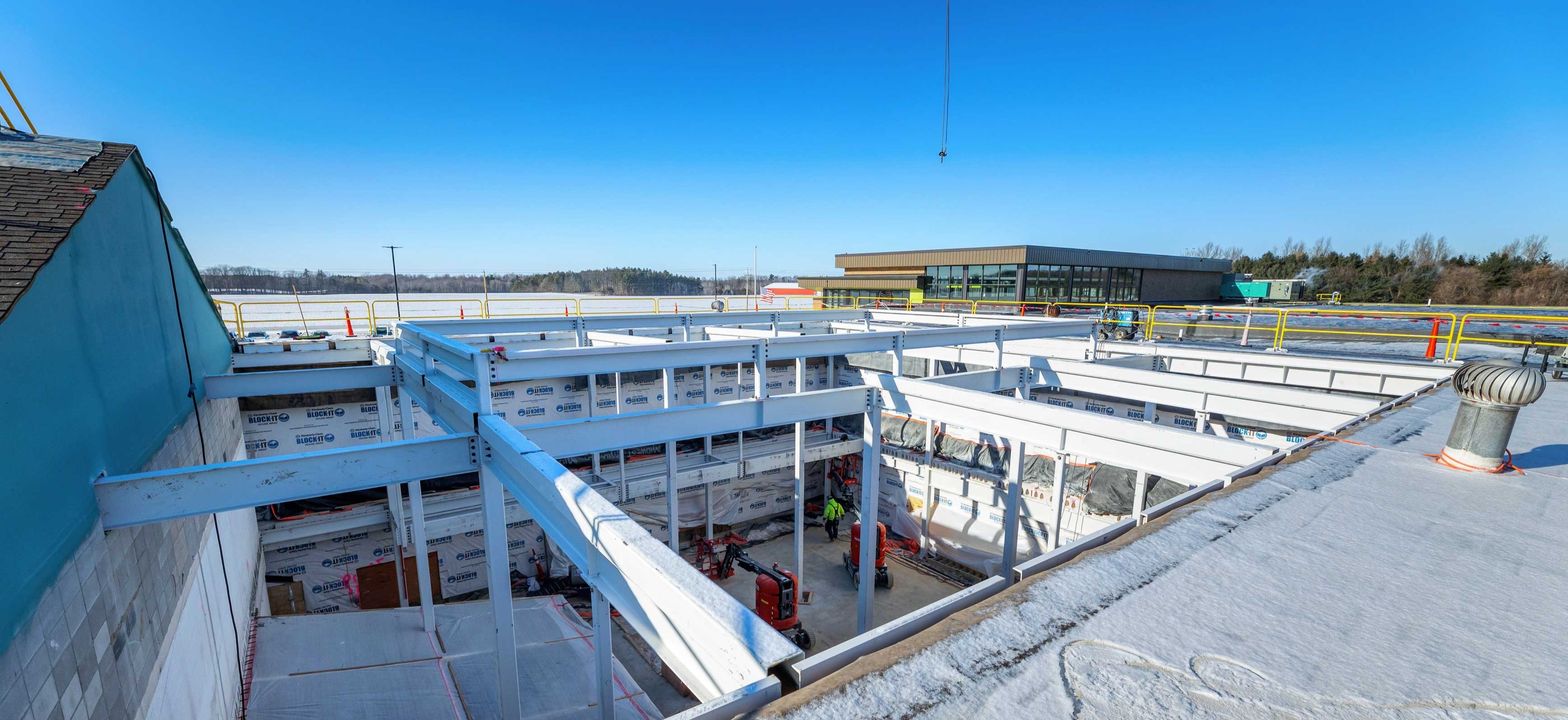 View from the rooftop of Sunnyside Elementary showing structural steel framing and temporary shoring installed during the center core demolition and skylight construction phase.