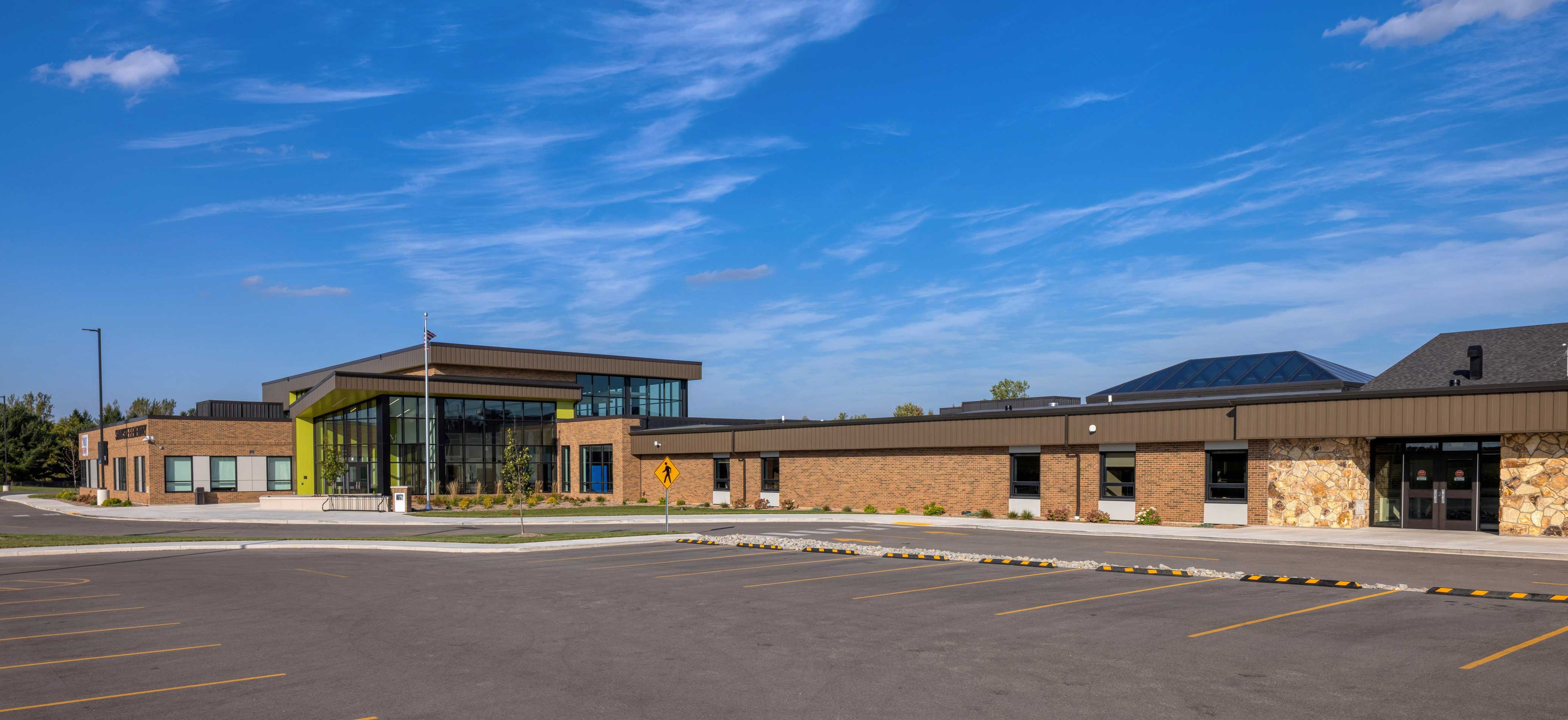 Exterior view of the completed Sunnyside Elementary School addition and renovation showing the new secure entrance and updated facade in Sobieski, Wisconsin.