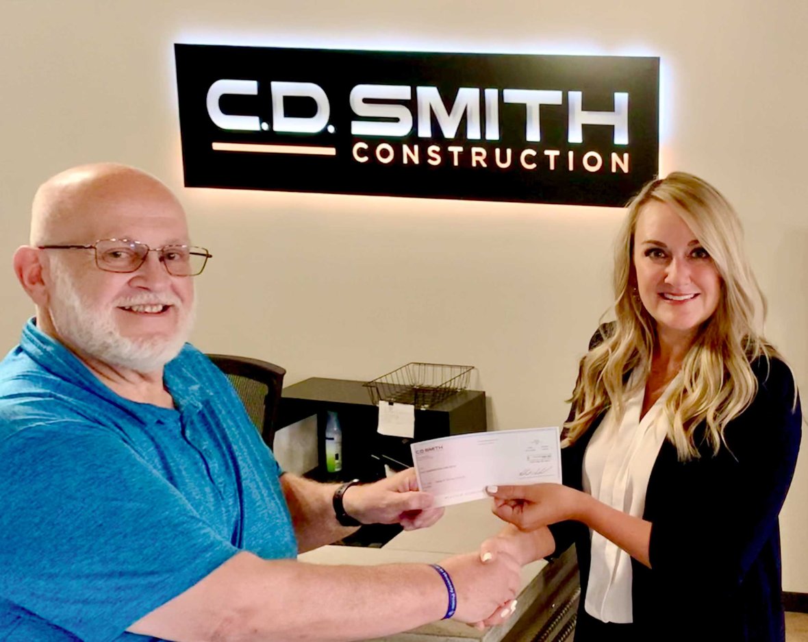 April Krahn (at right) pictured with SHP WI-Racine/Kenosha Chapter President Michael Prudhom at C.D. Smith Construction's Milwaukee Office