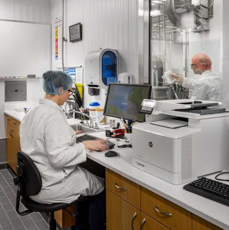 Research lab technicians working at UW-Madison Babcock Hall Center for Dairy Research Plant in Wisconsin building CD Smith