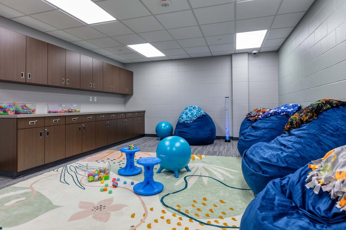Interactive hangout space at the Ripon Boys &amp; Girls Club featuring oversized bean bags and flexible seating—part of a youth-focused facility built through commercial construction services in Wisconsin to support comfort, connection, and enrichment.