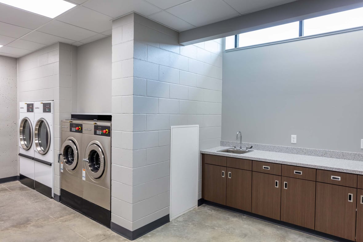 Laundry room at the Ripon Boys &amp; Girls Club, offering essential hygiene services for youth in a newly constructed facility built through commercial construction services in Wisconsin to support dignity and basic needs.
