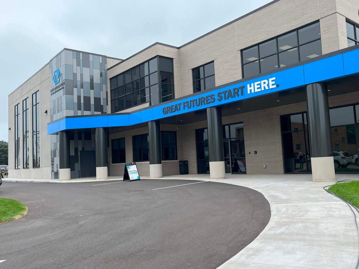 Exterior view of the Ripon Boys &amp; Girls Club featuring the drive-through entrance and “Great Futures Start Here” signage —part of a youth-focused facility built through commercial construction services in Wisconsin to support safety, accessibility, and community pride.