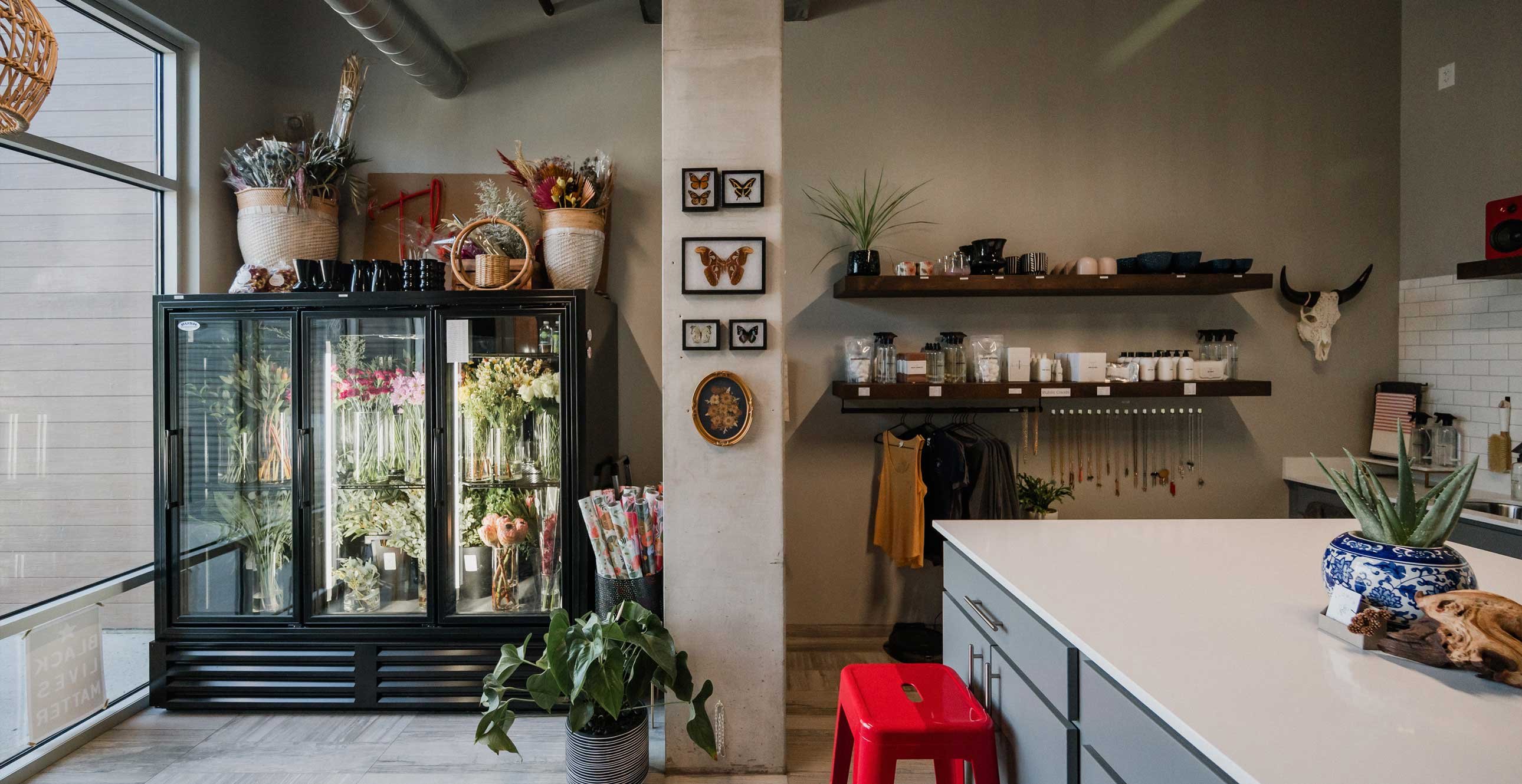 RiverHeath Willow retail flower shop interior with floral coolers, exposed concrete columns and contemporary finishes.