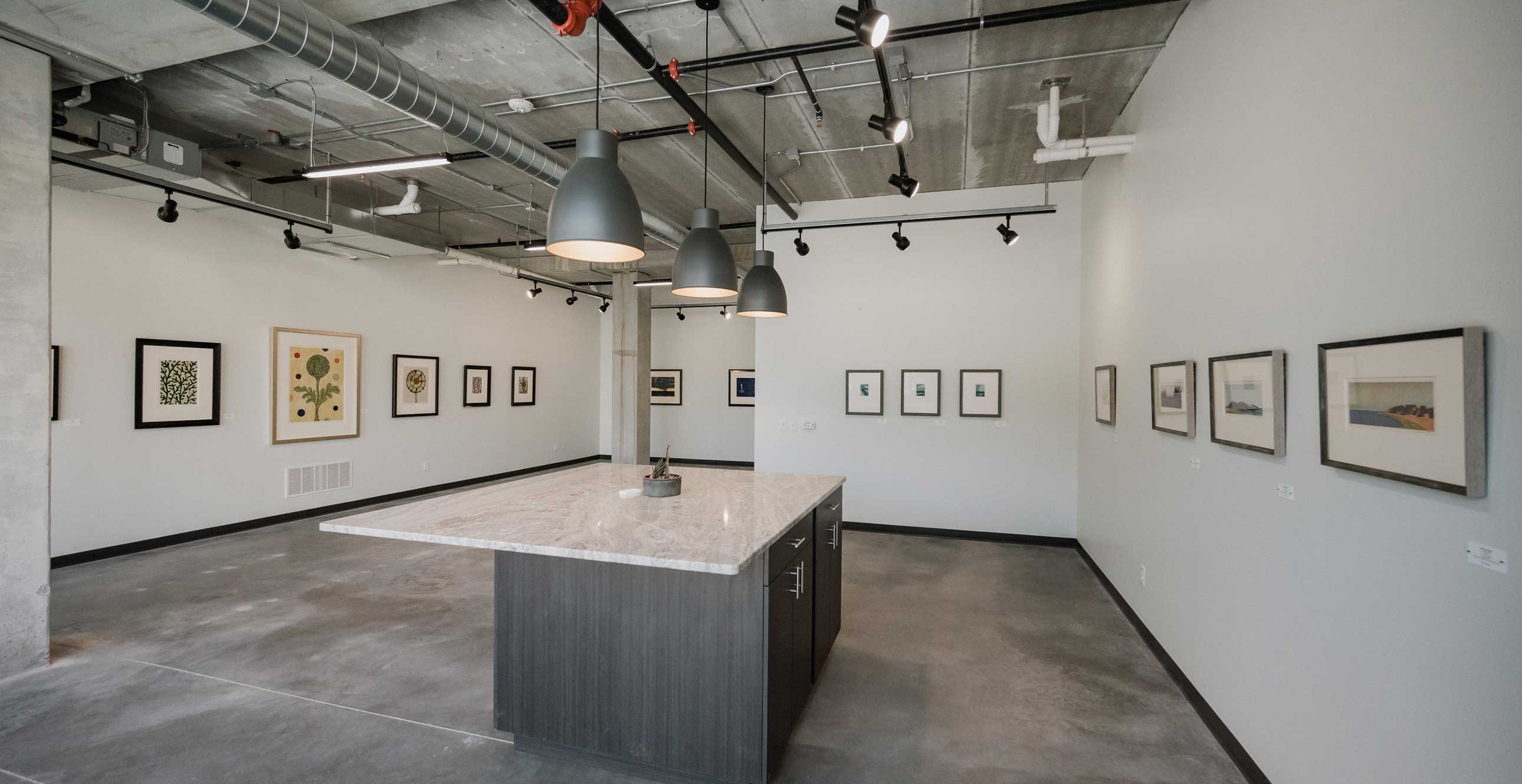 RiverHeath Willow mixed-use gallery interior with open floor plan, pendant lighting and display-ready wall space.