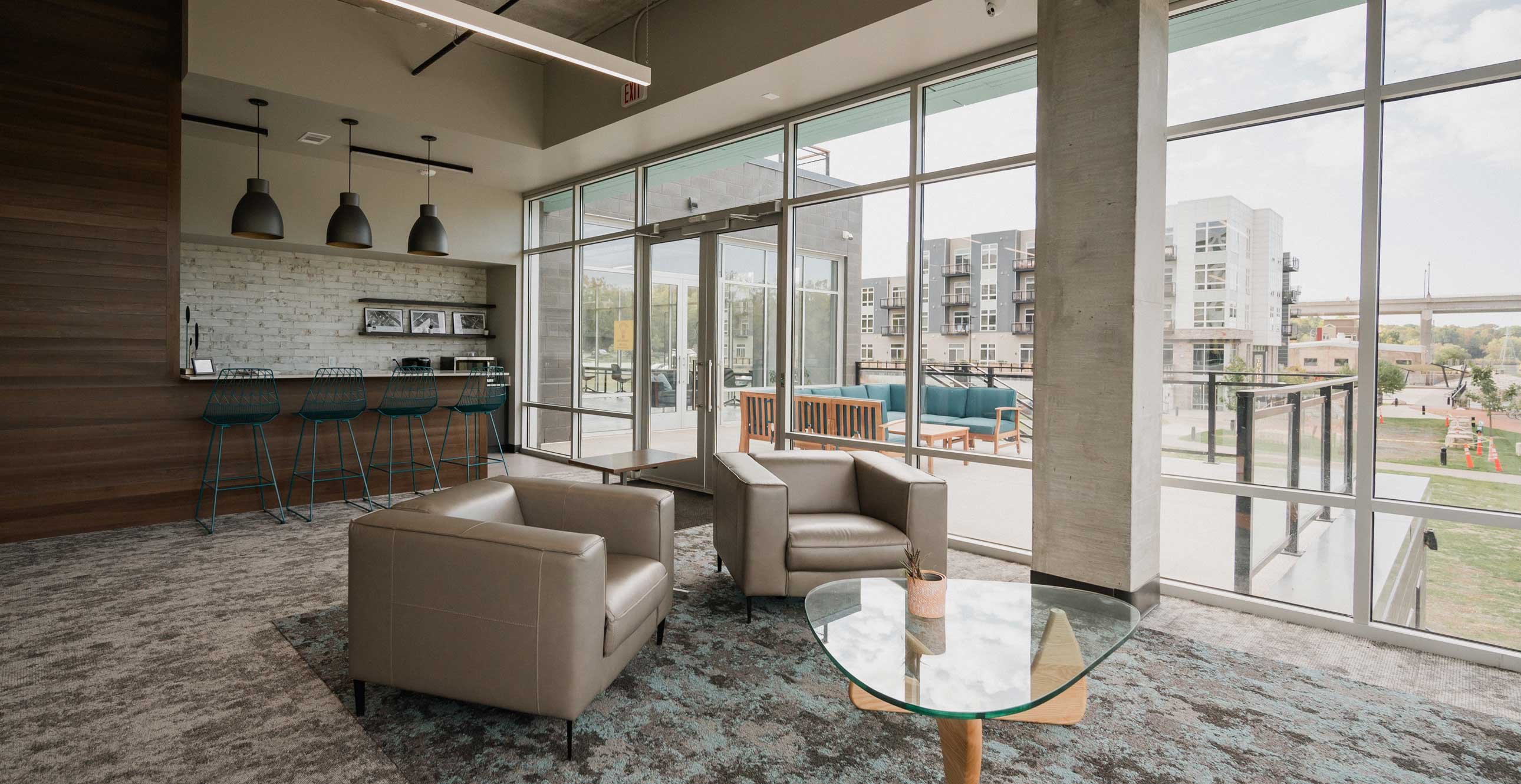 RiverHeath Willow shared office and lounge space with terrace access, modern seating and natural daylight.