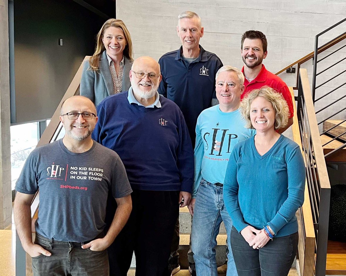 Holly Brenner and Connie Coon pose with Sleep in Heavenly Peace (SHP) chapter representatives at CD Smith Construction Office in Fond du Lac Wisconsin