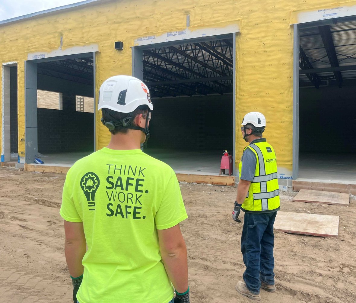 School District of Rhinelander Construction Project Progress Update with CD Smith Superintendent in front of partially completed Auto Lab with new roof and concrete floor on Wisconsin jobsite