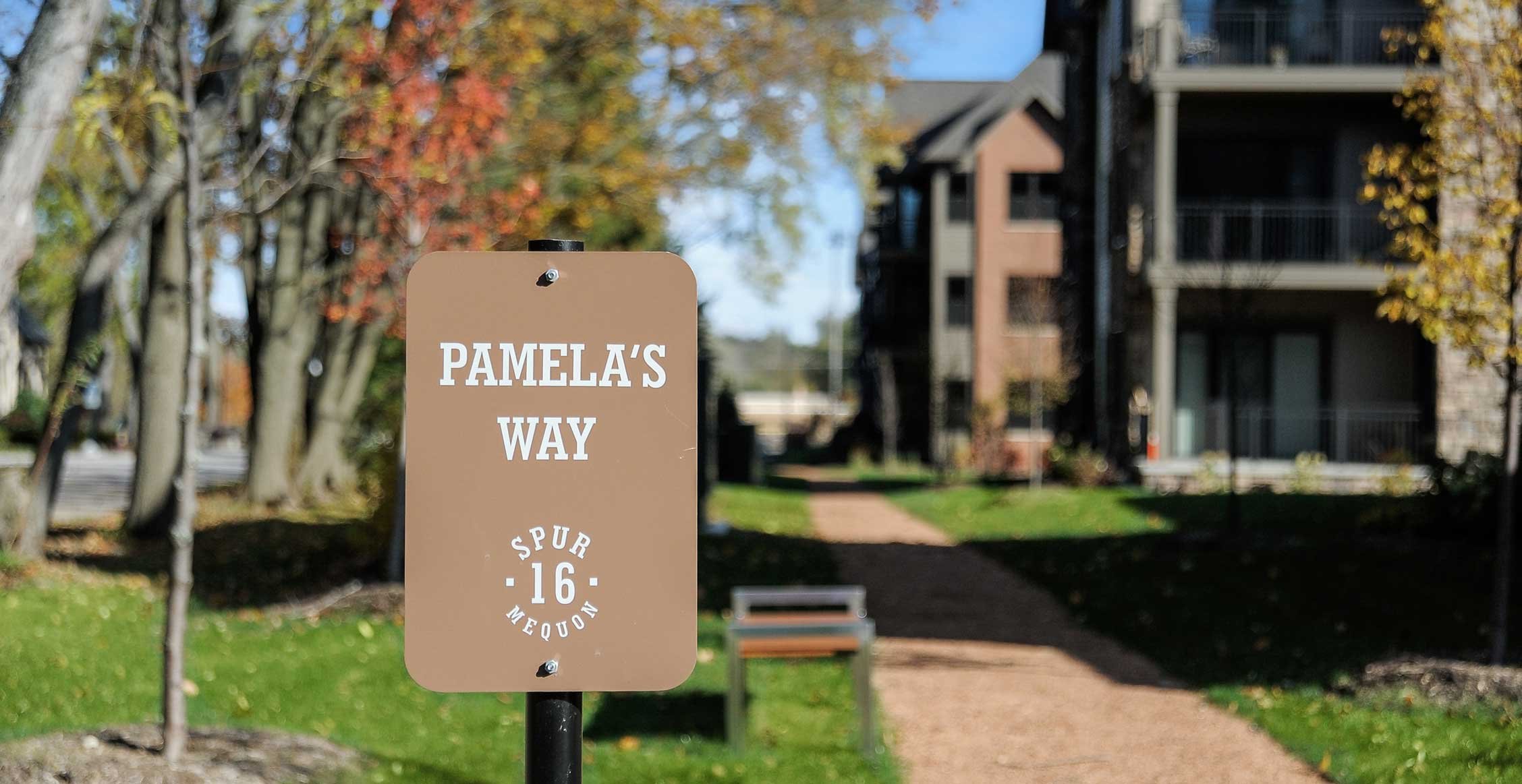 Pamela’s Way sign along a pedestrian path at Spur 16 in Mequon, Wisconsin.