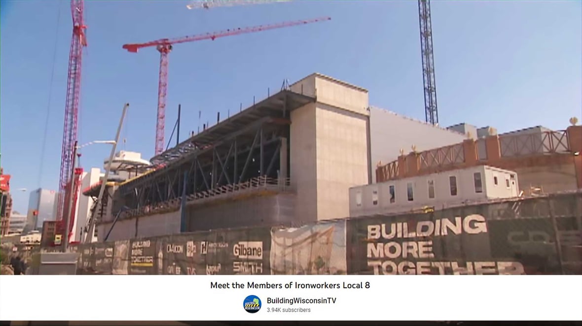 Street View of Wisconsin Baird Center Expansion Project Under Construction with Cranes and Steel Beams in Milwaukee