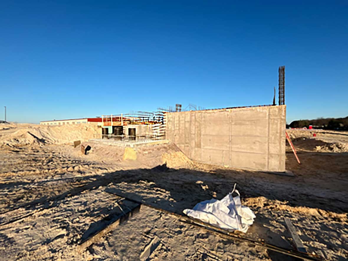 Construction progress on a municipal concrete hauled waste tank at the Reedsburg Wastewater Treatment Plant in Wisconsin, featuring advanced antimicrobial concrete for long-term durability