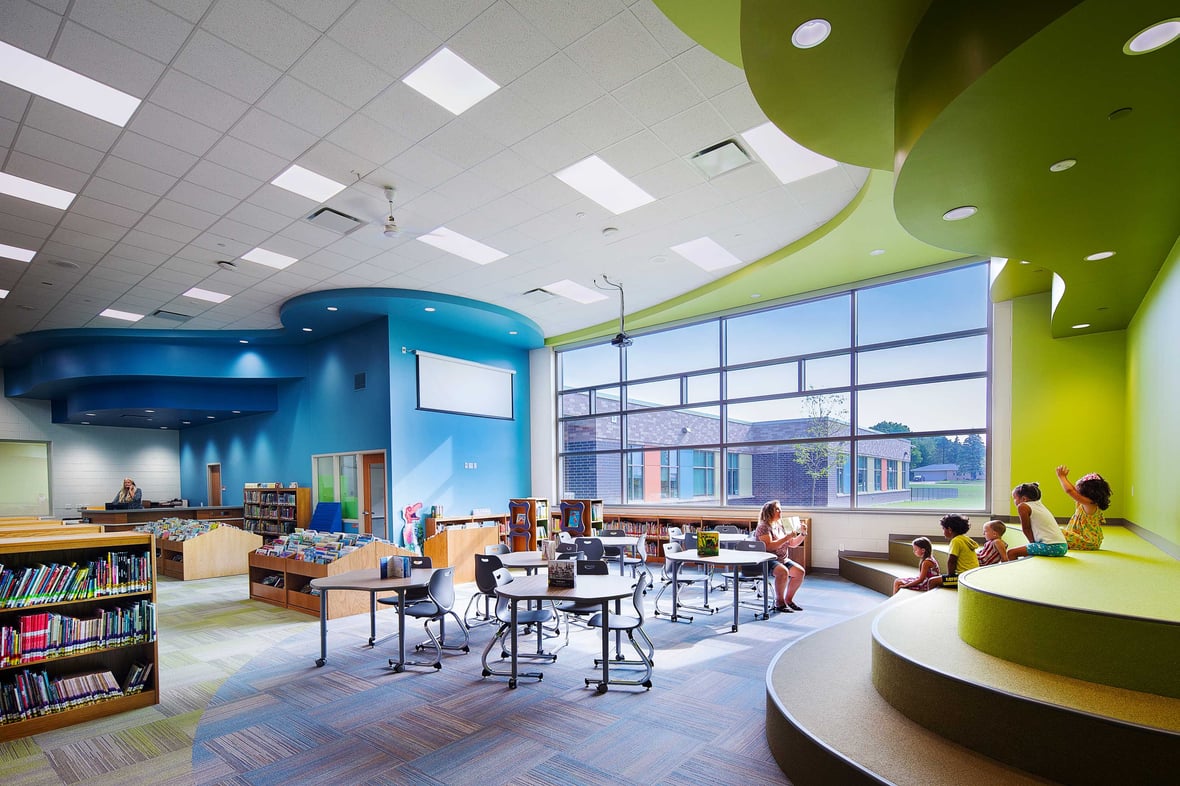 Teacher with Students in Wisconsin Public School Classroom & Library Built by CD Smith Construction