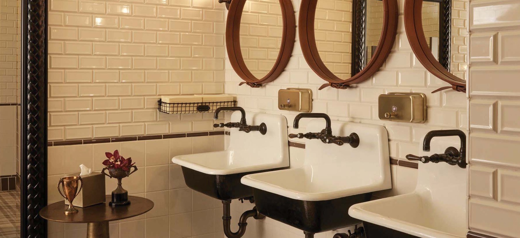 Men’s restroom at The Commodore with high-end finishes and modern design