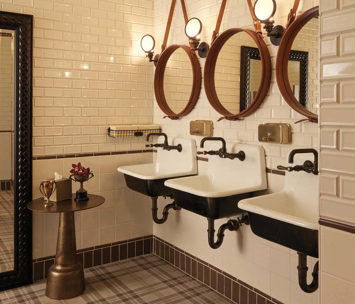 Men’s restroom at The Commodore with high-end finishes and modern design
