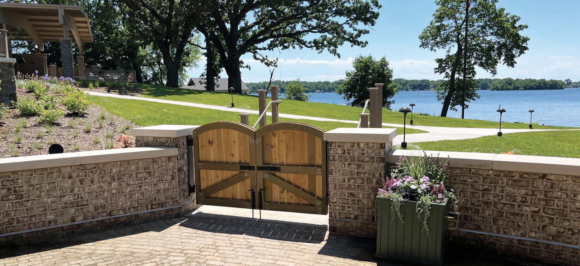 Stone terrace and lakefront gate at The Commodore in Delafield, WI