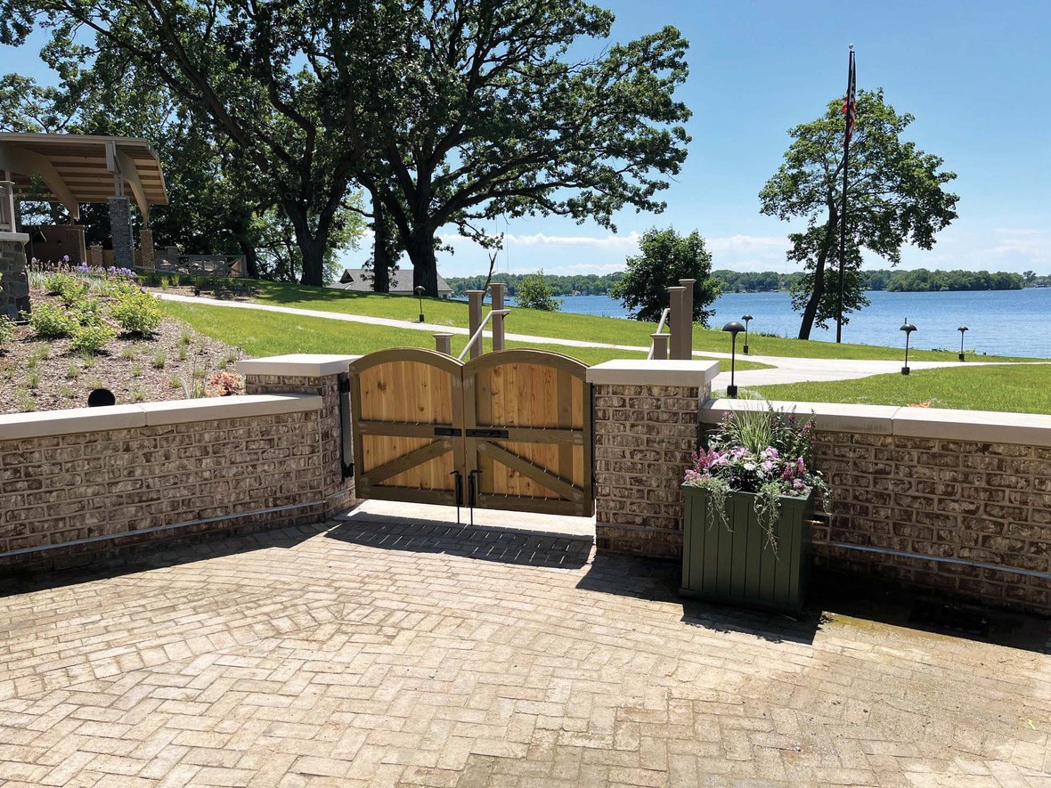 Stone terrace and lakefront gate at The Commodore in Delafield, WI