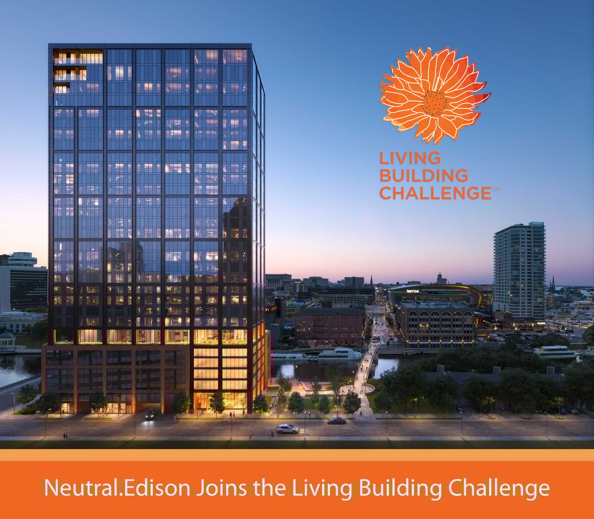 Aerial view of The Edison, a completed high-rise luxury apartment building with mass timber construction, located along the Milwaukee River in urban Wisconsin landscape with Living Building Challenge Logo overlay