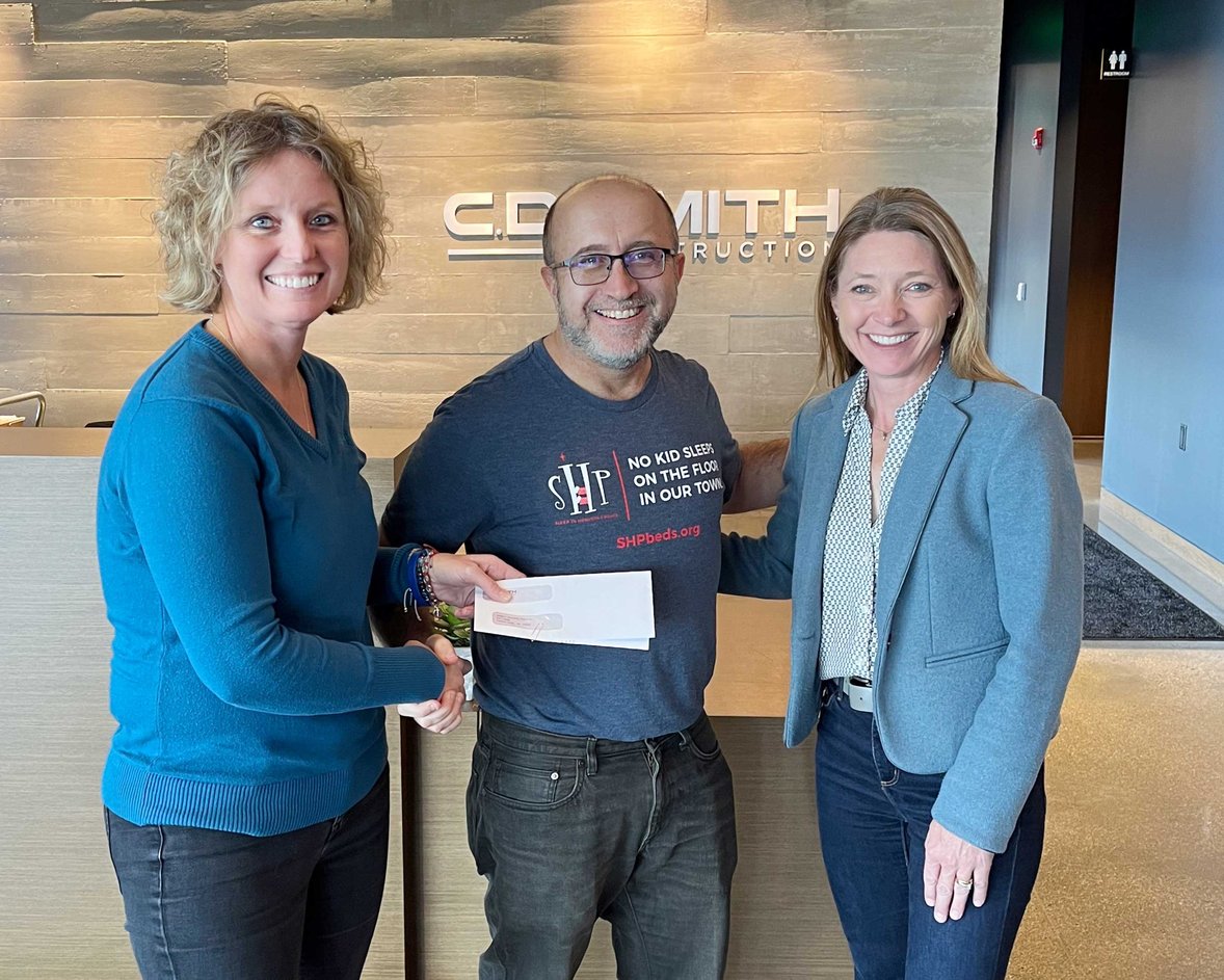 Connie Coon (at left) and Holly Brenner (at right) pictured with SHP WI-Fond du Lac Chapter Co-Presidents Tom Otte at C.D. Smith Construction's Fond du Lac Office