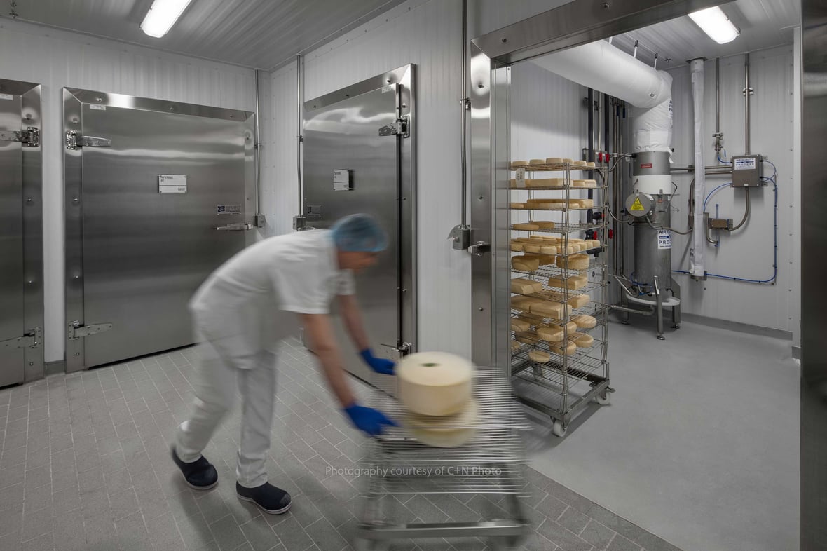 Staff at UW-Babcock Hall and Center for Dairy Research Wheel Cheese into Cheese Cave