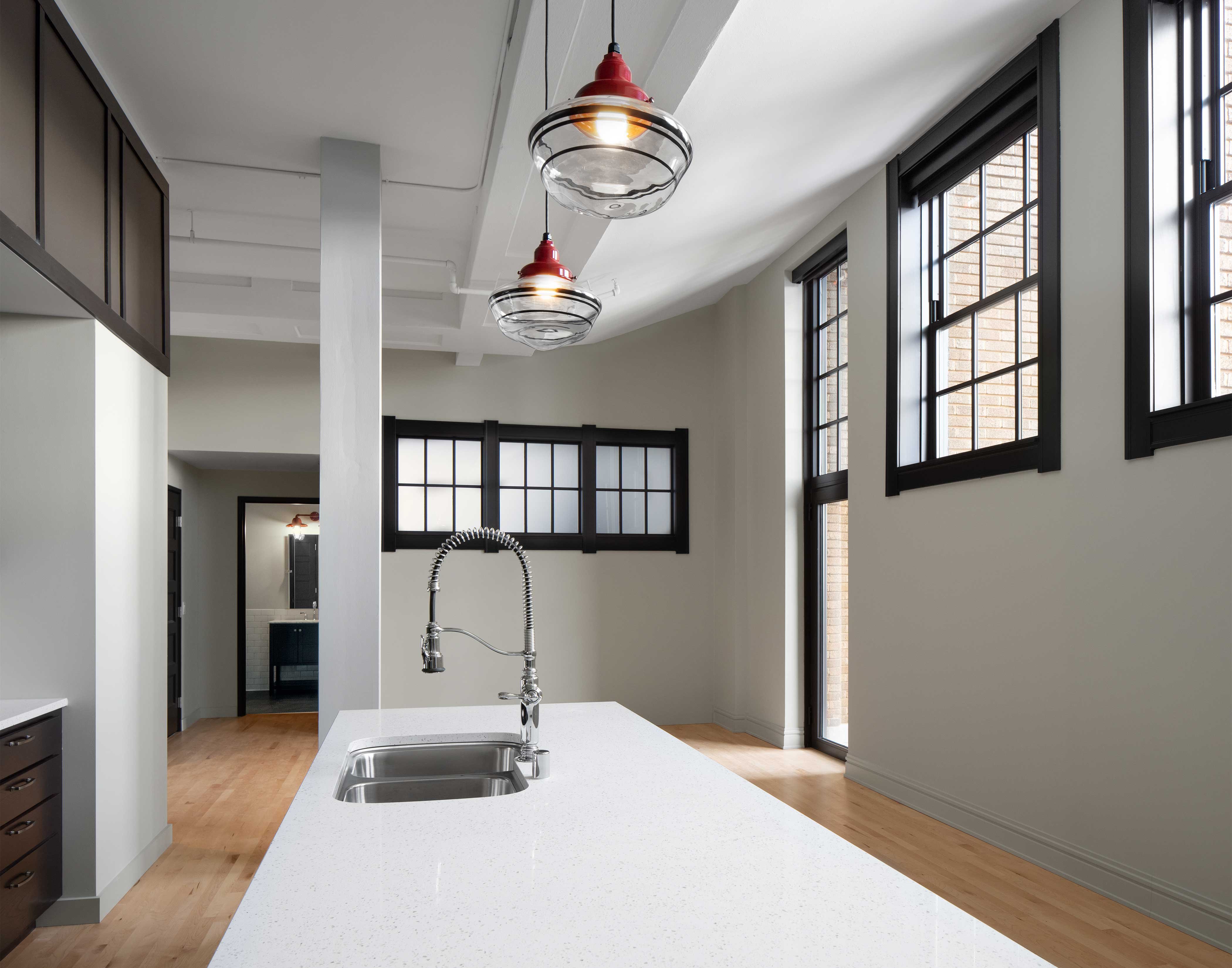 Whitney School Lofts historic construction rehabilitation project apartment unit kitchen