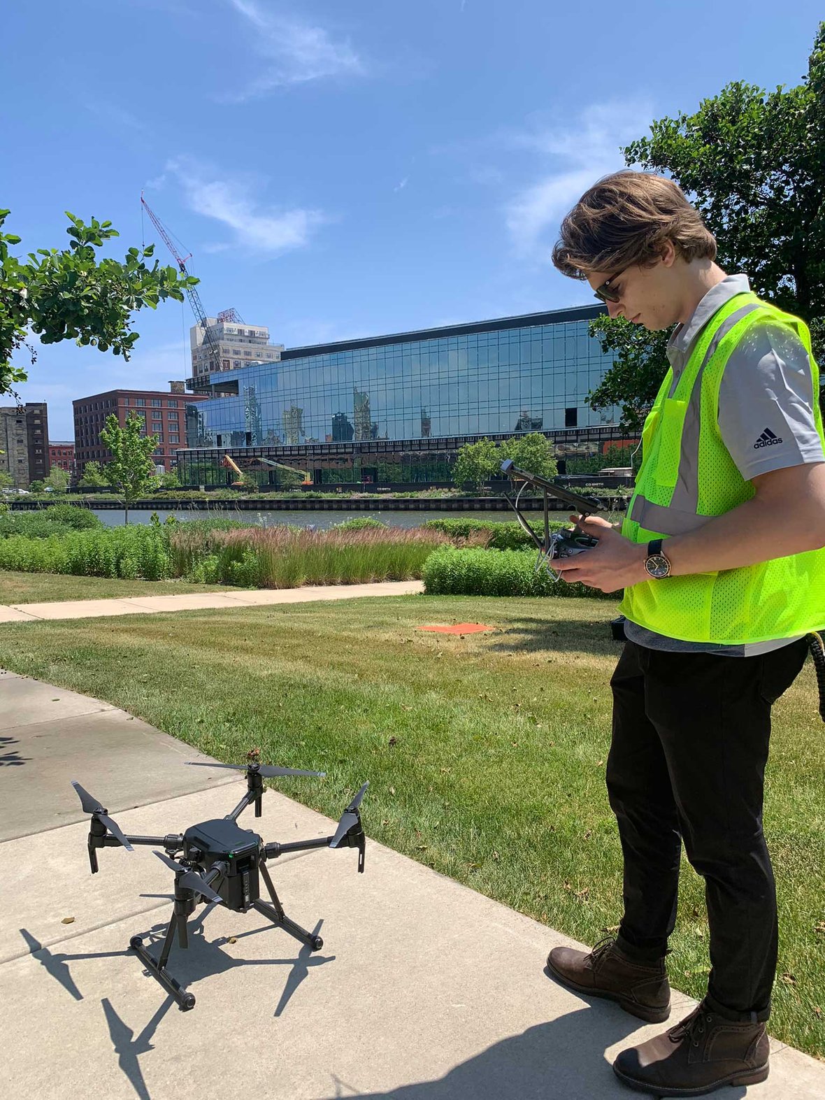 Virtual Design and Construction VDC Drone Pilot across river in Milwaukee by Rite-Hite for aerial project Update with CD Smith