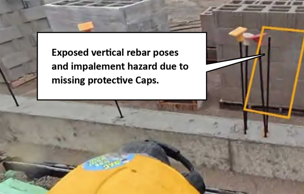 AI-identified exposed vertical rebar creating an impalement hazard due to missing protective caps on a construction jobsite.