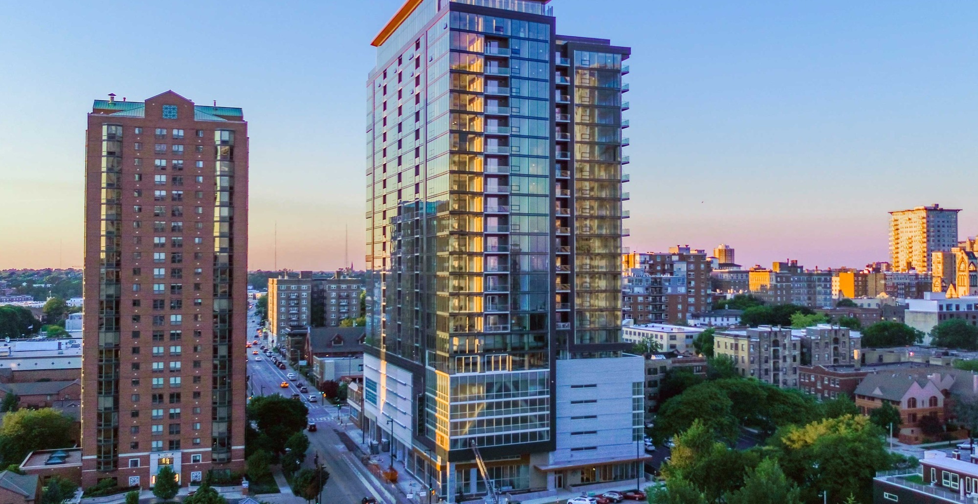 Aerial view of Ascent MKE in Milwaukee Wisconsin, the world’s tallest mass timber hybrid building showcasing sustainable design and modern urban construction.
