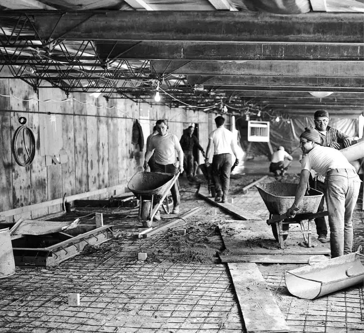 C.D. Smith Construction crew pouring concrete in 1965 including Superintendent Benny Krueger Clarence Brabitt and Wally Zills.