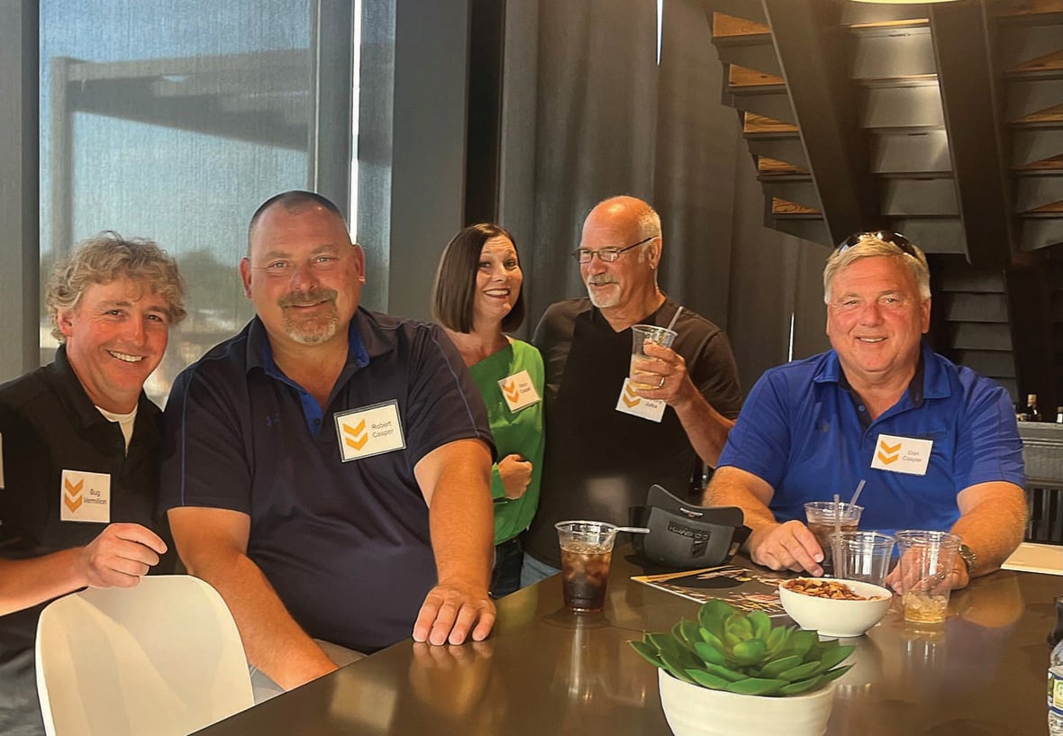 C.D. Smith Construction employees recognized for 25 years of service, standing together at the annual celebration honoring dedication and craftsmanship.