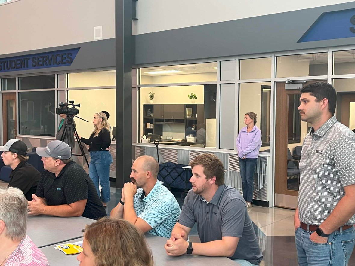 C.D. Smith Project Manager William Theisen attends the Howards Grove Middle School ribbon cutting ceremony with community members.