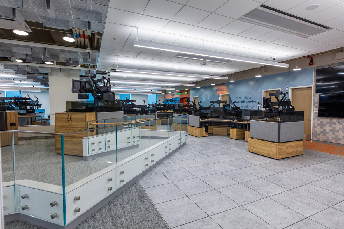 Workstations behind glass partitions inside the Forensic Science and Protective Medicine Facility.