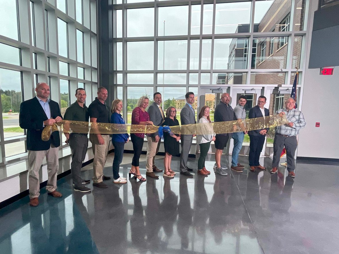 Leaders and project partners at the Howards Grove Middle School ribbon cutting event celebrating the completion of the new facility.