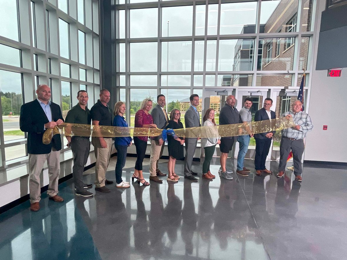 Leaders and project partners at the Howards Grove Middle School ribbon cutting event celebrating the completion of the new facility.